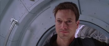 Movie still from “Mission to Mars” (2000), directed by Brian De Palma – A person wearing a black shirt; Close Up shot, Over the shoulder angle