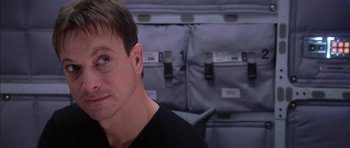 Movie still from “Mission to Mars” (2000), directed by Brian De Palma – A person sitting in a chair; Close Up shot, Over the shoulder angle