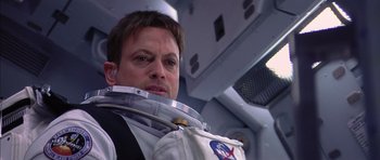 Movie still from “Mission to Mars” (2000), directed by Brian De Palma – A person wearing a space suit; Close Up shot, Over the shoulder angle
