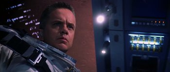 Movie still from “Mission to Mars” (2000), directed by Brian De Palma – A person wearing a neck brace; Close Up shot, Low angle