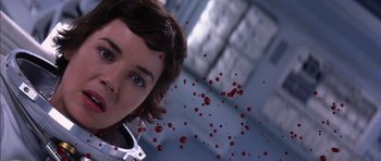 Movie still from “Mission to Mars” (2000), directed by Brian De Palma – A woman with blue eyes is surrounded by blood drops; Close Up shot, Low angle