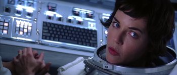 Movie still from “Mission to Mars” (2000), directed by Brian De Palma – A woman in a space suit looking at a computer screen; Close Up shot, Low angle