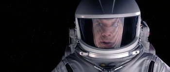 Movie still from “Mission to Mars” (2000), directed by Brian De Palma – A man in a spacesuit looking into a mirror; Close Up shot, Overhead angle