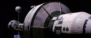 Movie still from “Mission to Mars” (2000), directed by Brian De Palma – An image of an astronaut on the side of a space ship; Extreme Wide shot, Overhead angle