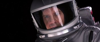 Movie still from “Mission to Mars” (2000), directed by Brian De Palma – A man wearing a space suit and a helmet; Close Up shot, Overhead angle