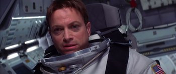 Movie still from “Mission to Mars” (2000), directed by Brian De Palma – A person wearing a space suit; Close Up shot, Overhead angle