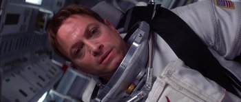 Movie still from “Mission to Mars” (2000), directed by Brian De Palma – A person wearing a space suit; Close Up shot, Overhead angle
