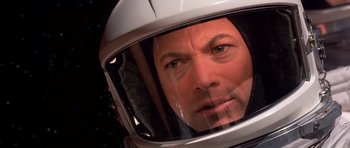 Movie still from “Mission to Mars” (2000), directed by Brian De Palma – A person wearing a helmet; Close Up shot, Overhead angle