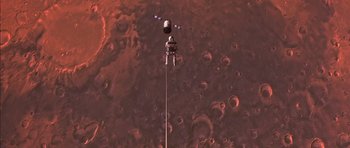 Movie still from “Mission to Mars” (2000), directed by Brian De Palma – An image of an astronaut on the surface of the moon; Extreme Wide shot, Overhead angle