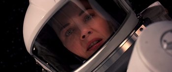Movie still from “Mission to Mars” (2000), directed by Brian De Palma – A person wearing a helmet; Close Up shot, Overhead angle