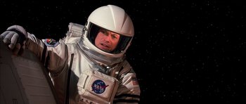 Movie still from “Mission to Mars” (2000), directed by Brian De Palma – A man in a space suit and a helmet; Medium shot, Overhead angle