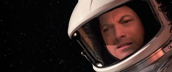 Movie still from “Mission to Mars” (2000), directed by Brian De Palma – A person wearing a helmet; Close Up shot, Overhead angle