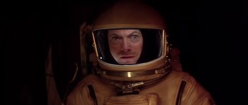 Movie still from “Mission to Mars” (2000), directed by Brian De Palma – A man wearing a space suit and a helmet; Close Up shot, Overhead angle