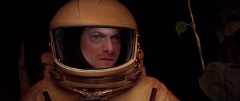 Movie still from “Mission to Mars” (2000), directed by Brian De Palma – A man wearing a space suit and a helmet; Close Up shot, Overhead angle