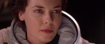 Movie still from “Mission to Mars” (2000), directed by Brian De Palma – A woman's face in a mirror; Close Up shot, Over the shoulder angle