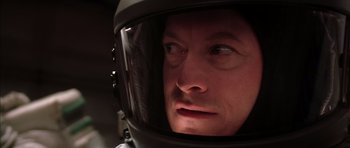Movie still from “Mission to Mars” (2000), directed by Brian De Palma – A person wearing a motorcycle helmet; Close Up shot, Overhead angle