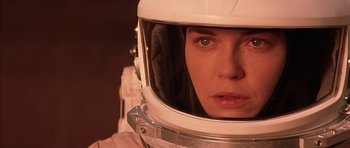 Movie still from “Mission to Mars” (2000), directed by Brian De Palma – A person wearing a space helmet; Close Up shot, Over the shoulder angle