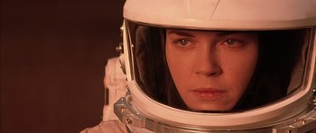Movie still from “Mission to Mars” (2000), directed by Brian De Palma – A person wearing a space helmet; Close Up shot, Over the shoulder angle