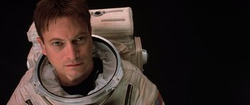 Movie still from “Mission to Mars” (2000), directed by Brian De Palma – A man wearing a space suit and helmet; Close Up shot, Overhead angle