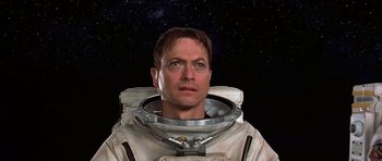 Movie still from “Mission to Mars” (2000), directed by Brian De Palma – A man in a spacesuit is looking at the camera; Close Up shot, Low angle