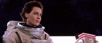 Movie still from “Mission to Mars” (2000), directed by Brian De Palma – A woman in a space suit looking to her left; Close Up shot, Low angle