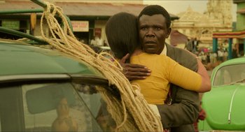 Movie still from “Mississippi Masala” (1991), directed by Mira Nair – A man and a woman hugging in a street; Close Up shot, Over the shoulder angle