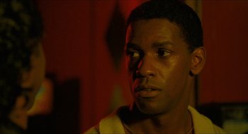 Movie still from “Mississippi Masala” (1991), directed by Mira Nair – A person looking at the camera; Close Up shot, Over the shoulder angle