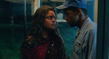 Movie still from “Mississippi Masala” (1991), directed by Mira Nair – A man and a woman standing next to each other; Close Up shot, Low angle