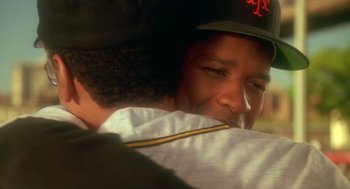 Movie still from “Mo' Better Blues” (1990), directed by Spike Lee – A baseball player hugging another player; Close Up shot, Over the shoulder angle