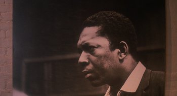 Movie still from “Mo' Better Blues” (1990), directed by Spike Lee – A black and white photo of a man looking to his left; Close Up shot, Low angle