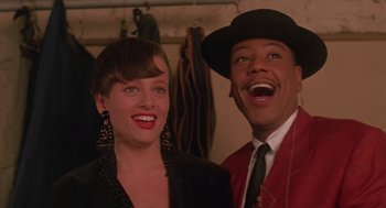 Movie still from “Mo' Better Blues” (1990), directed by Spike Lee – A man and a woman posing for a picture; Close Up shot, Low angle