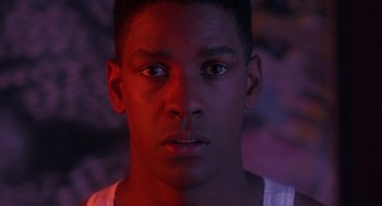 Movie still from “Mo' Better Blues” (1990), directed by Spike Lee – A young man is looking into the camera; Close Up shot, Low angle