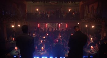 Movie still from “Mo' Better Blues” (1990), directed by Spike Lee – A group of people sitting in a room at night; Wide shot, Low angle