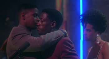 Movie still from “Mo' Better Blues” (1990), directed by Spike Lee – A couple of people that are kissing in a room; Close Up shot, Over the shoulder angle