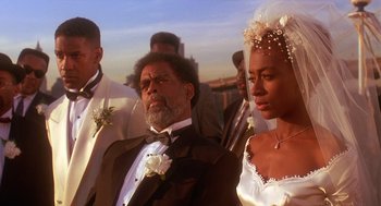 Movie still from “Mo' Better Blues” (1990), directed by Spike Lee – A man and a woman in wedding attire; Close Up shot, Low angle