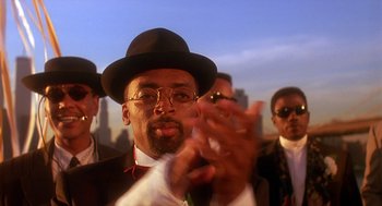 Movie still from “Mo' Better Blues” (1990), directed by Spike Lee – A group of men in suits and hats clapping; Close Up shot, Low angle