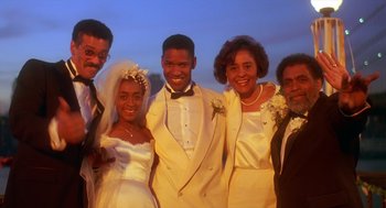 Movie still from “Mo' Better Blues” (1990), directed by Spike Lee – A group of people standing next to each other in formal wear; Medium shot, Low angle