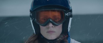 Movie still from “Molly's Game” (2017), directed by Aaron Sorkin – A woman wearing goggles and a helmet; Close Up shot, Low angle