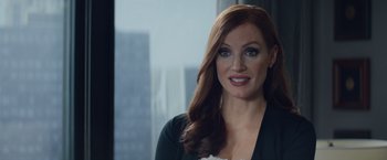 Movie still from “Molly's Game” (2017), directed by Aaron Sorkin – A person with long red hair; Close Up shot, Over the shoulder angle