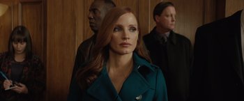 Movie still from “Molly's Game” (2017), directed by Aaron Sorkin – A person wearing a coat; Close Up shot, Over the shoulder angle