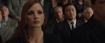 Movie still from “Molly's Game” (2017), directed by Aaron Sorkin – A group of people sitting in a room; Close Up shot, Over the shoulder angle