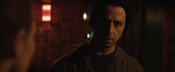 Movie still from “Molly's Game” (2017), directed by Aaron Sorkin – A person wearing a hoodie; Close Up shot, Over the shoulder angle