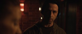 Movie still from “Molly's Game” (2017), directed by Aaron Sorkin – A person wearing a hoodie; Close Up shot, Over the shoulder angle