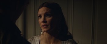 Movie still from “Molly's Game” (2017), directed by Aaron Sorkin – A beautiful woman with long dark brown hair; Close Up shot, Over the shoulder angle