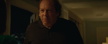 Movie still from “Molly's Game” (2017), directed by Aaron Sorkin – A person wearing a black shirt; Close Up shot, Over the shoulder angle