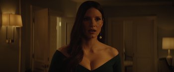 Movie still from “Molly's Game” (2017), directed by Aaron Sorkin – A woman with long dark brown hair wearing a black dress; Close Up shot, Low angle