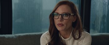 Movie still from “Molly's Game” (2017), directed by Aaron Sorkin – A person wearing glasses and a white shirt; Close Up shot, Over the shoulder angle