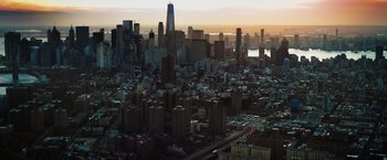 Movie still from “Molly's Game” (2017), directed by Aaron Sorkin – An aerial view of a large city at sunset; Extreme Wide shot, High angle