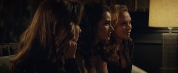 Movie still from “Molly's Game” (2017), directed by Aaron Sorkin – A group of women sitting next to each other in a dark room; Close Up shot, Over the shoulder angle