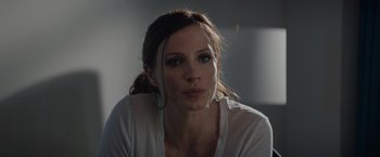 Movie still from “Molly's Game” (2017), directed by Aaron Sorkin – A beautiful woman sitting in front of a window; Close Up shot, Low angle